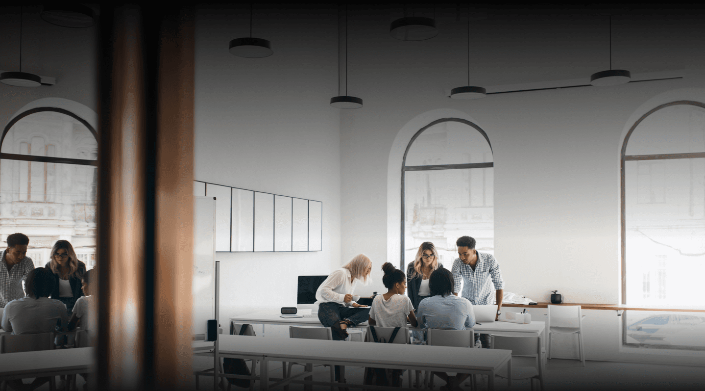 People discussing in white office